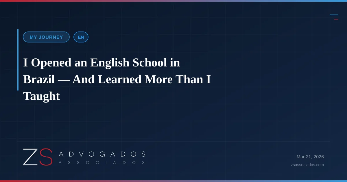 Zac standing in front of his English school, with students and teacher colleagues